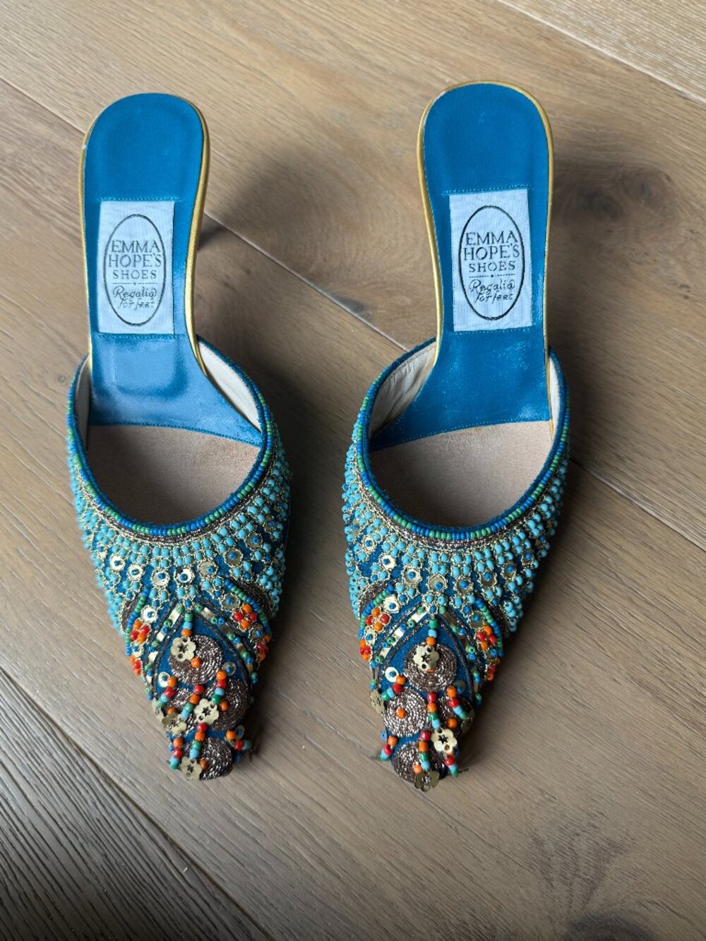 Emma Hopes beaded turquoise mule heels with coral beading and gold embroidery